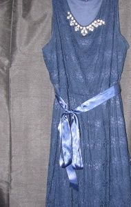 Blue knee length dress.